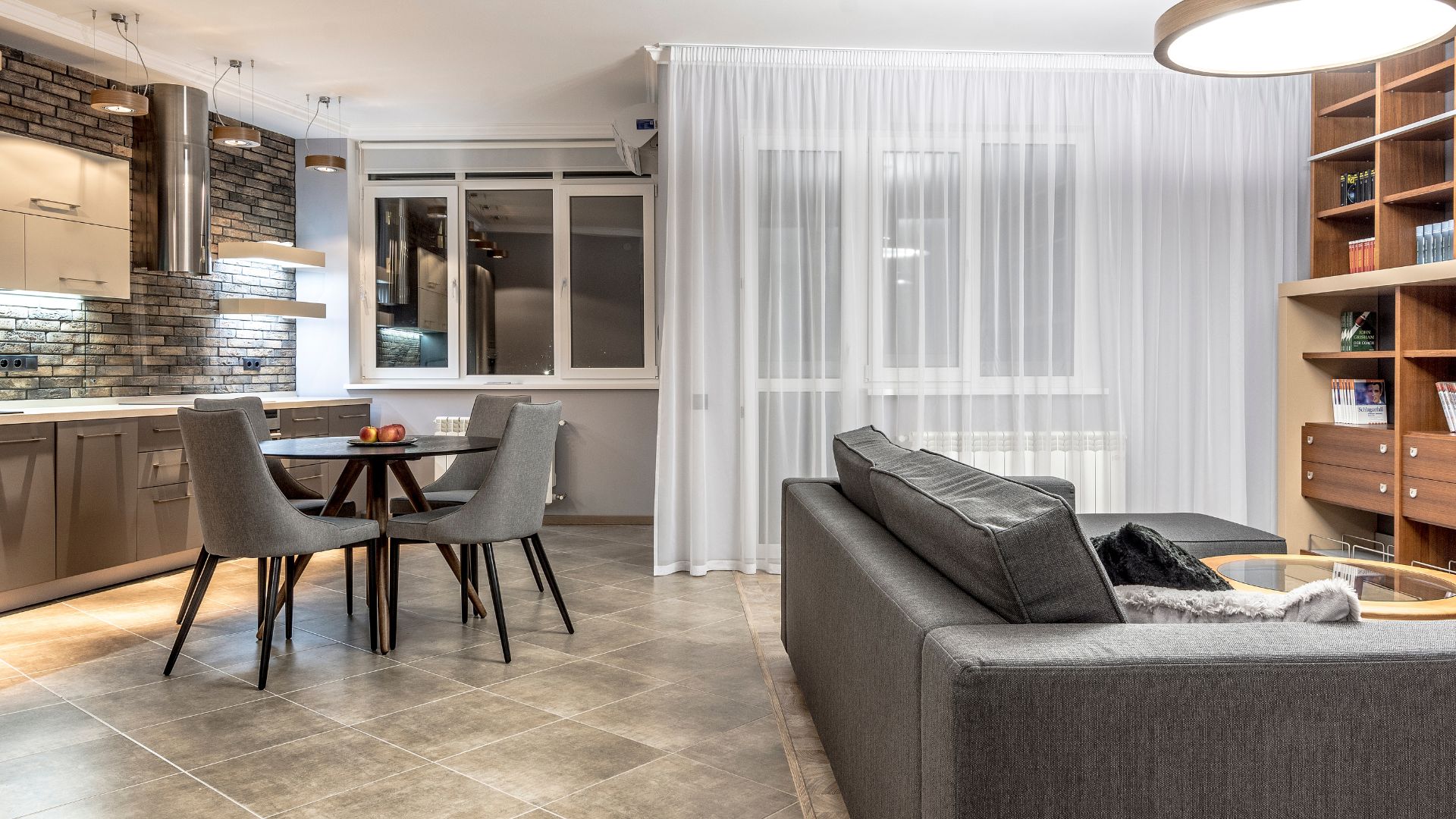 A living room filled with furniture and a dining room table