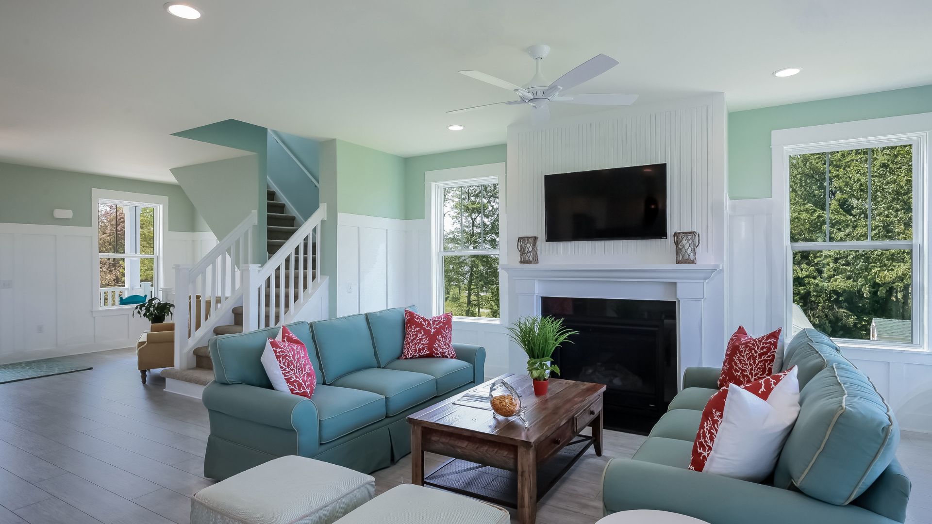 A living room filled with furniture and a flat screen tv